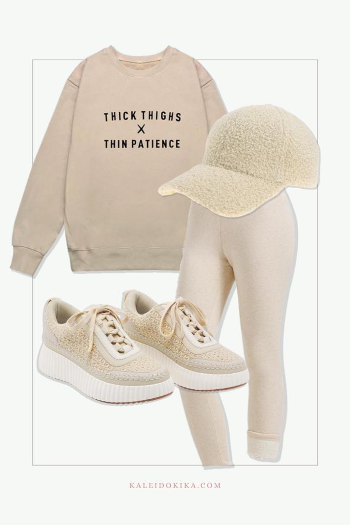 Cute and casual beige outfit with warm leggings, graphic sweatshirt and a fleece cap