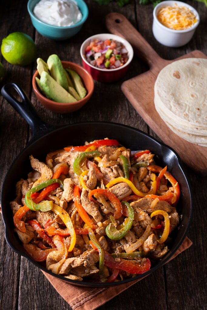 Image of chicken fajitas made in a crockpot perfect for summer