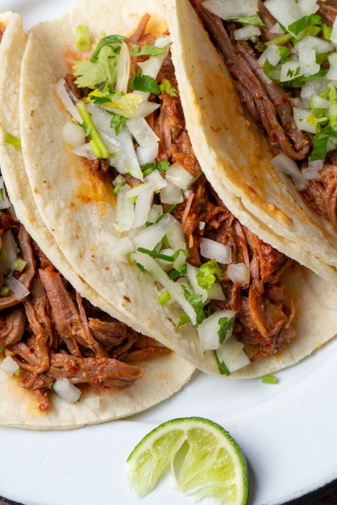 Image of shredded beef made in a crockpot perfect for summer