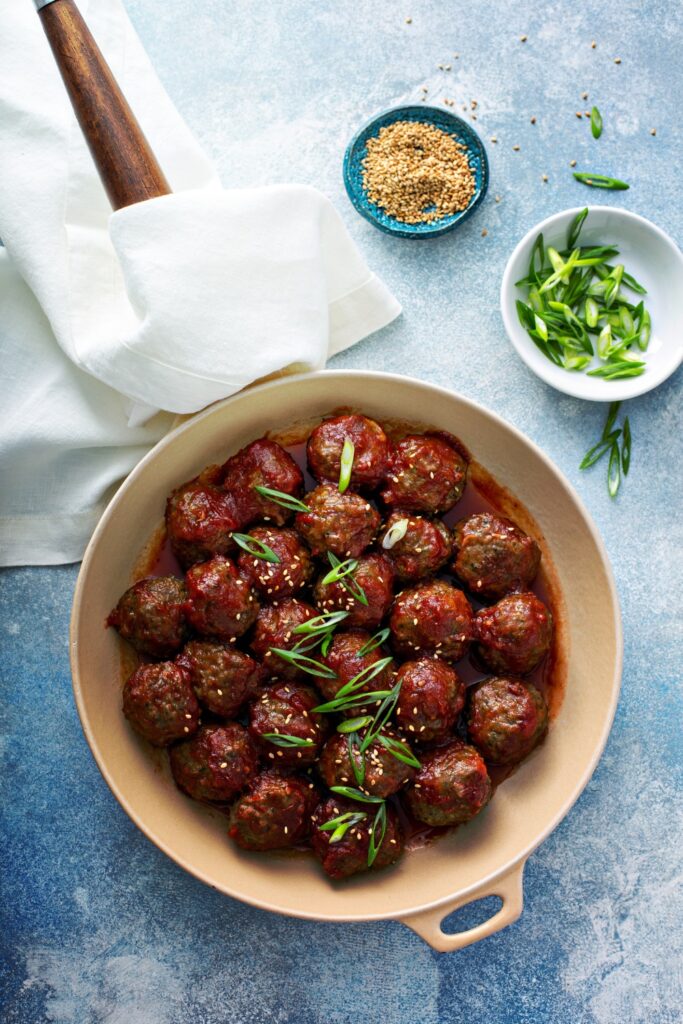 Image of sweet and sour meatballs made in a crockpot perfect for summer