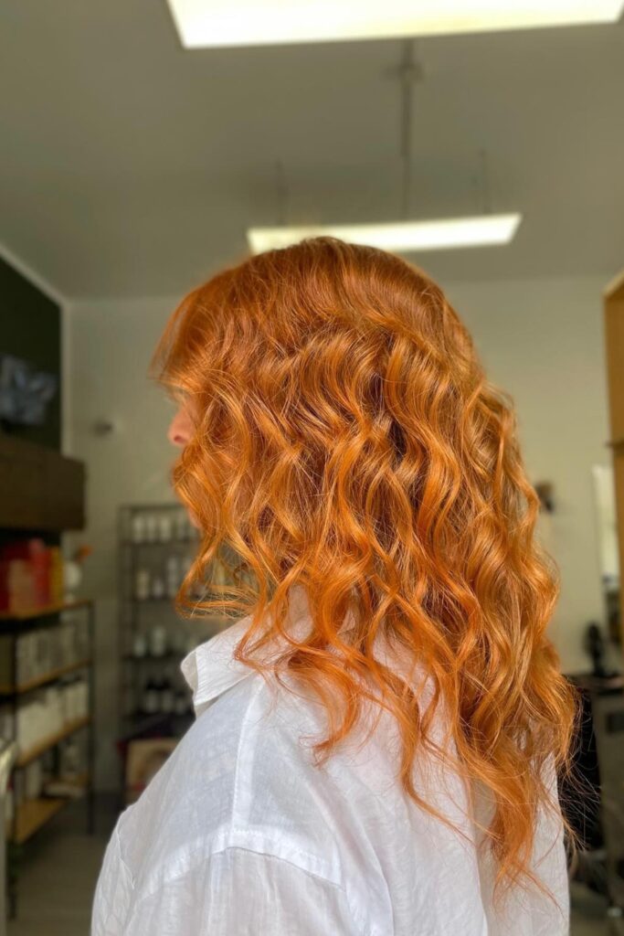 Image showing a summer hair trend color which is bright orange